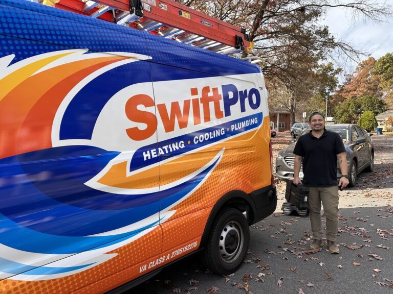 A SwiftPro technician beside a wrapped SwiftPro van in a Northern Virginia driveway, with the Virginia Class A contractor license number 2705192276 on the panel