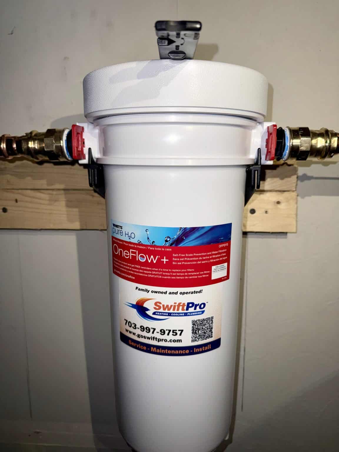 A whole-house water filter SwiftPro installed on the main water line in a Northern Virginia home, with the SwiftPro service sticker on it