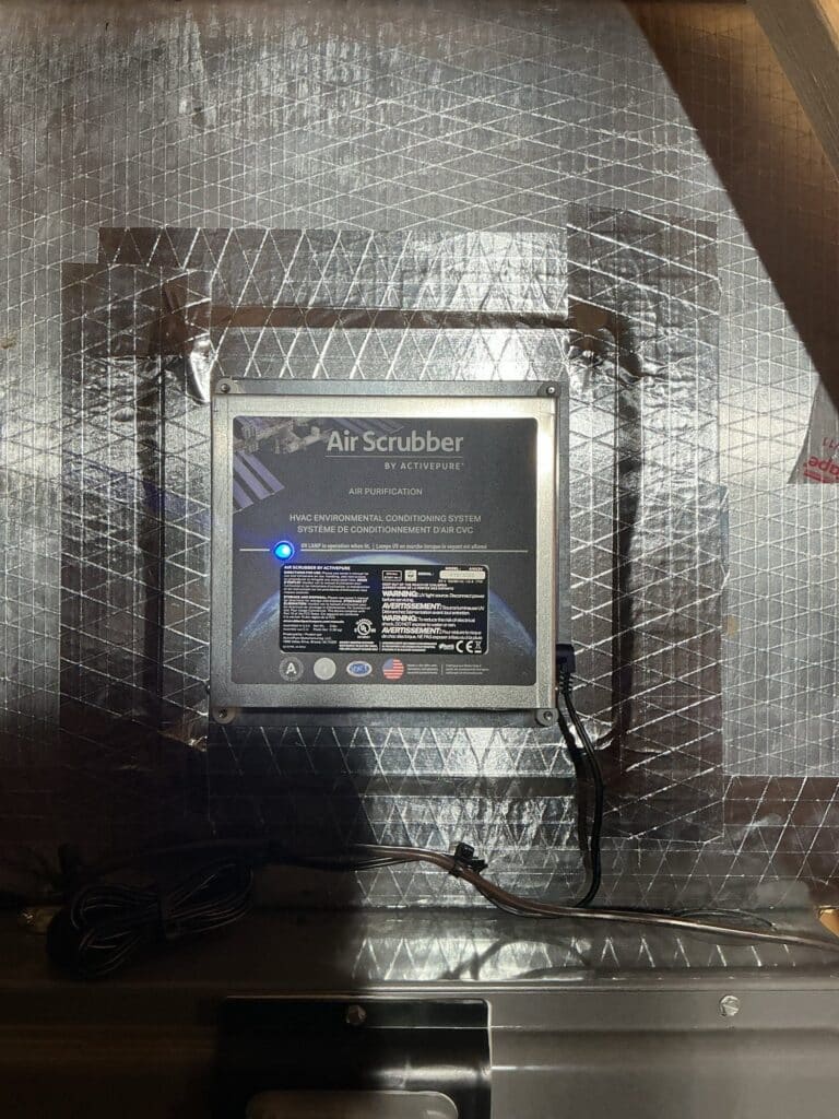 An ActivePure Air Scrubber installed in the supply ductwork of a Northern Virginia home, UV lamp lit
