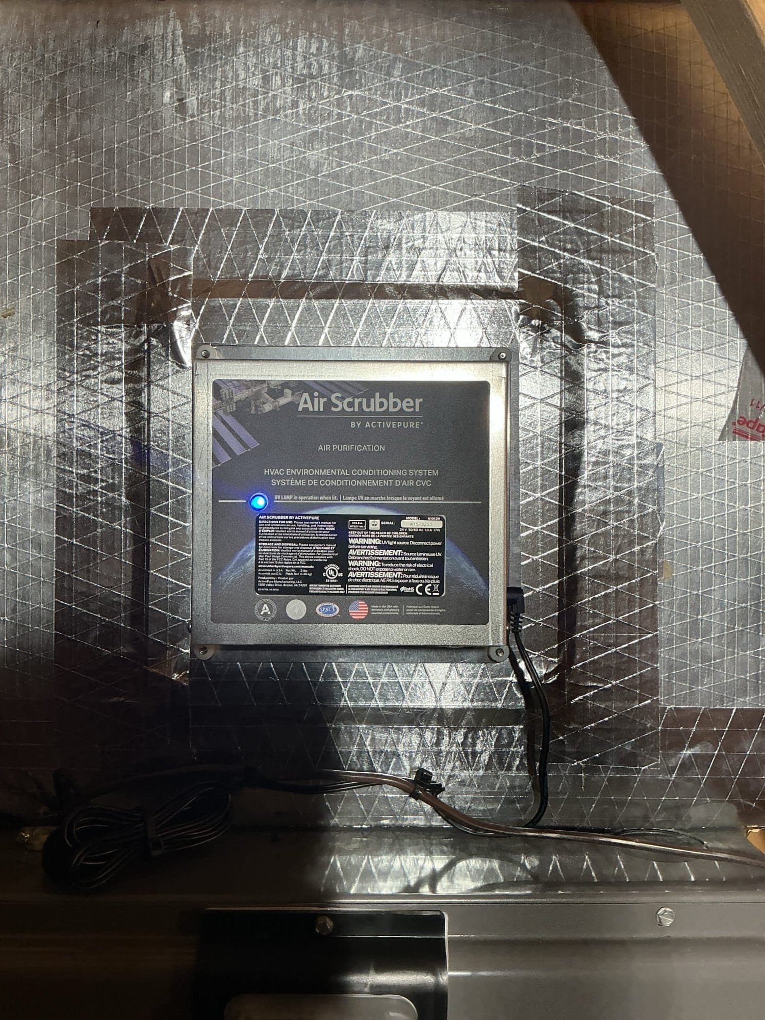 Air Scrubber by ActivePure installed by SwiftPro in the supply ductwork of an Ashburn, VA home, UV lamp lit