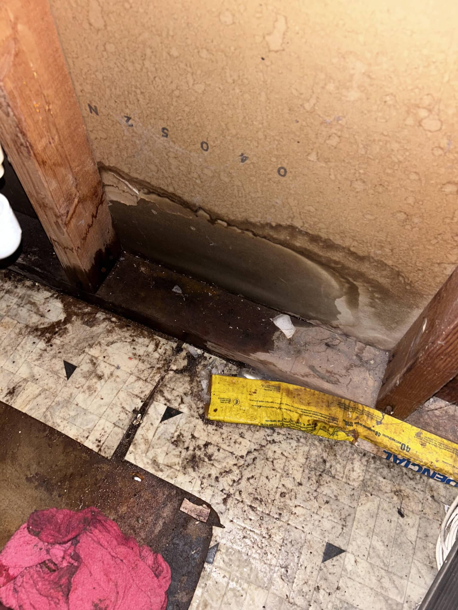 Close-up view of a leaking pipe indicating a potential plumbing emergency