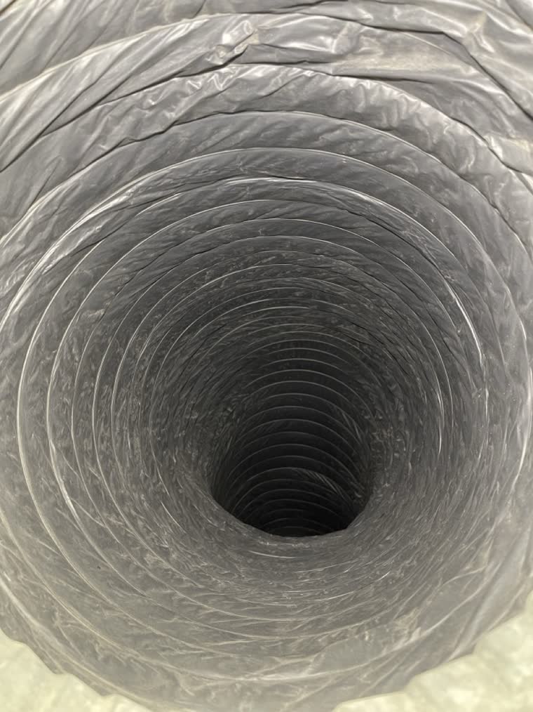 The same flexible duct in the same Northern Virginia home after SwiftPro cleaned it, the corrugations clear down the run