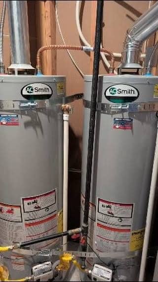 Two A.O. Smith gas water heaters with new venting and gas lines, installed by SwiftPro in Northern Virginia
