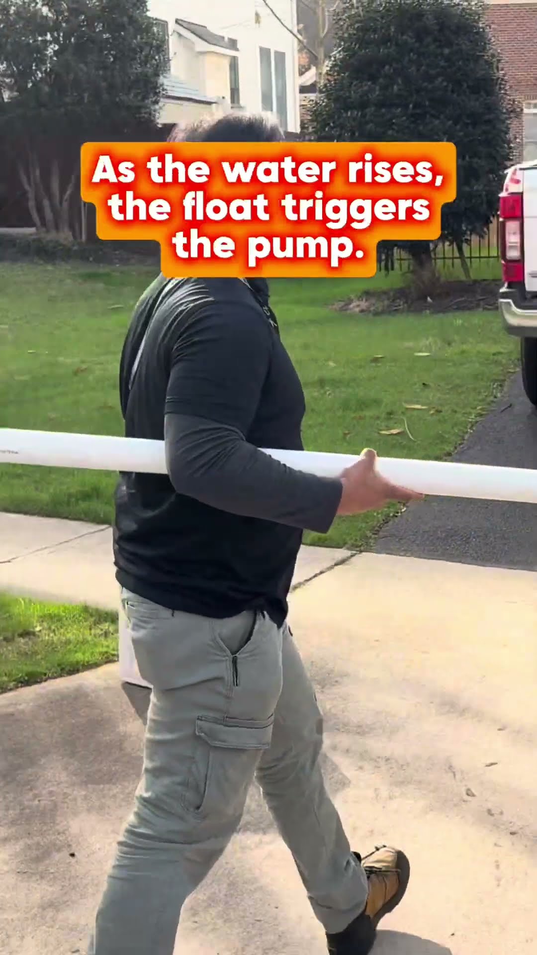 Sump pump explainer: an old rusted sump basin lid, a tech carrying white PVC pipe across a driveway past a lawn and pickup truck, and new PVC discharge piping with a check valve in a basement.