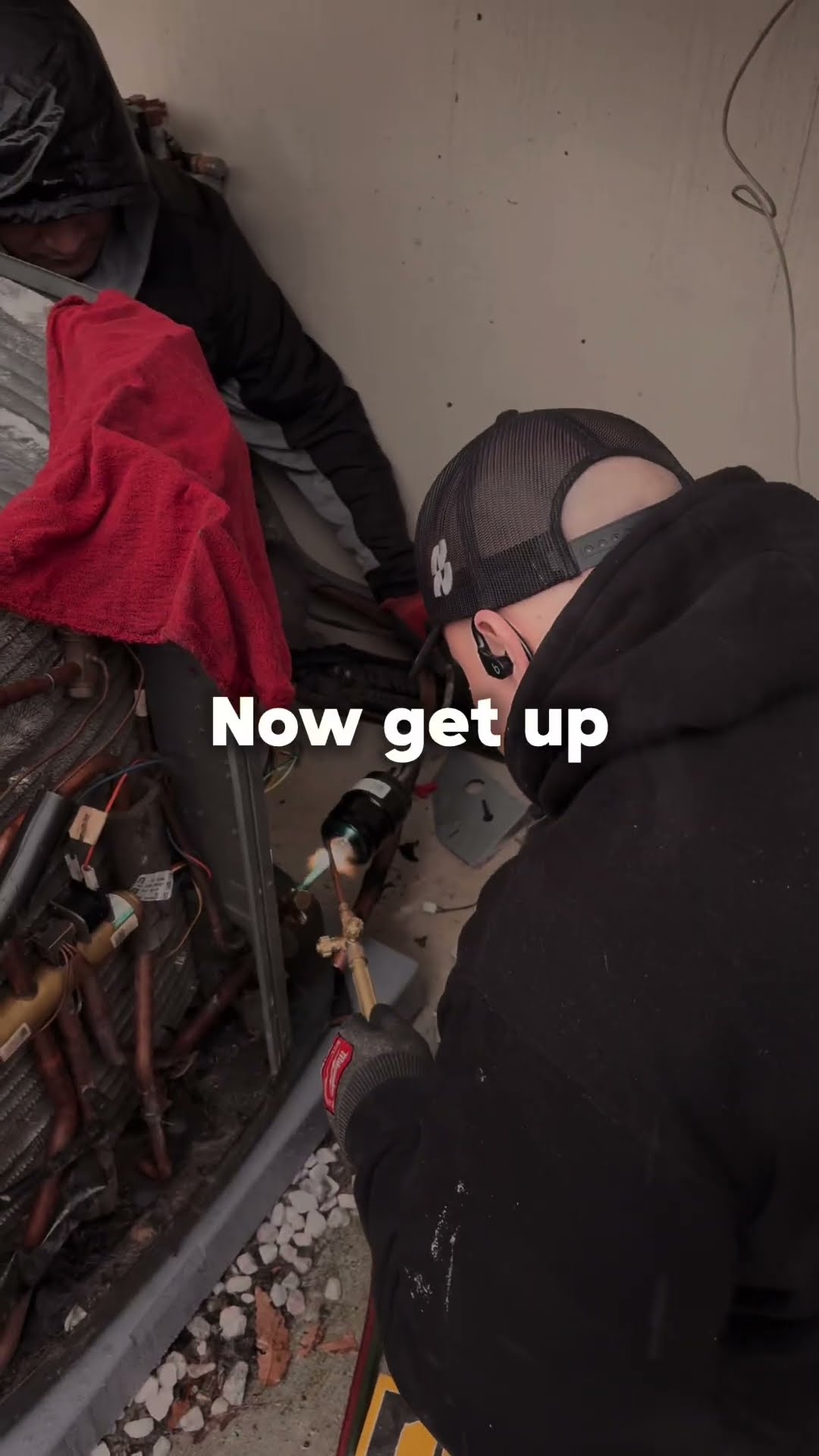 Montage: two techs (one in a hard hat) work inside a packaged unit cabinet, a tech brazes at a condenser, and a tech in a grey hoodie works a pipe in a dirt trench seen from above.