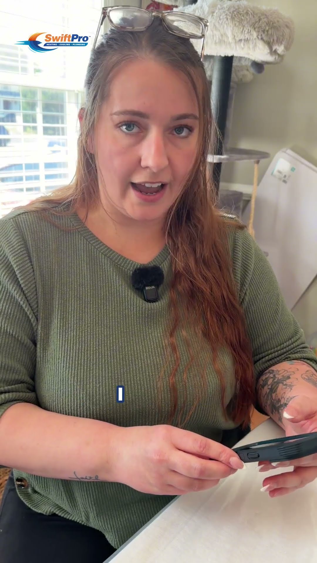 A Northern Virginia mom with a lav mic sits at her kitchen table and explains why she had her family's drinking water tested, holding up a water test result.